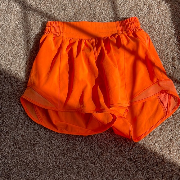 lululemon athletica Pants - bright orange lululemon 4” low rise hotty hots
